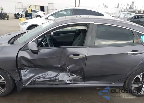 2016 Honda Civic Touring z USA, uszkodzony, nr VIN 19XFC1F95GE022641